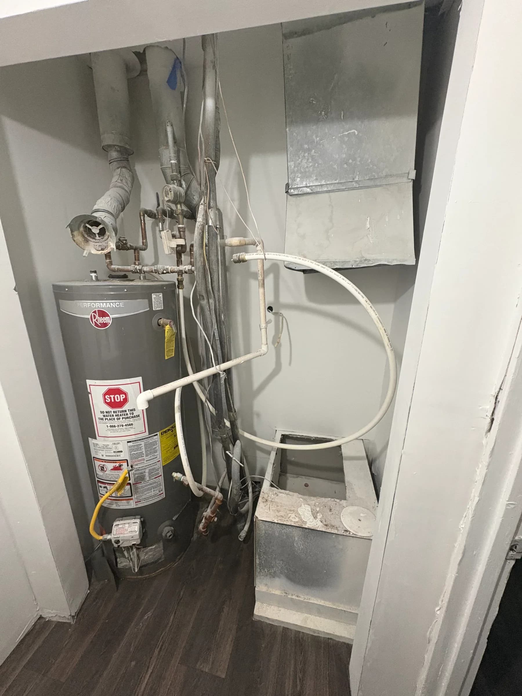 Water heater installation and plumbing work in residential setting