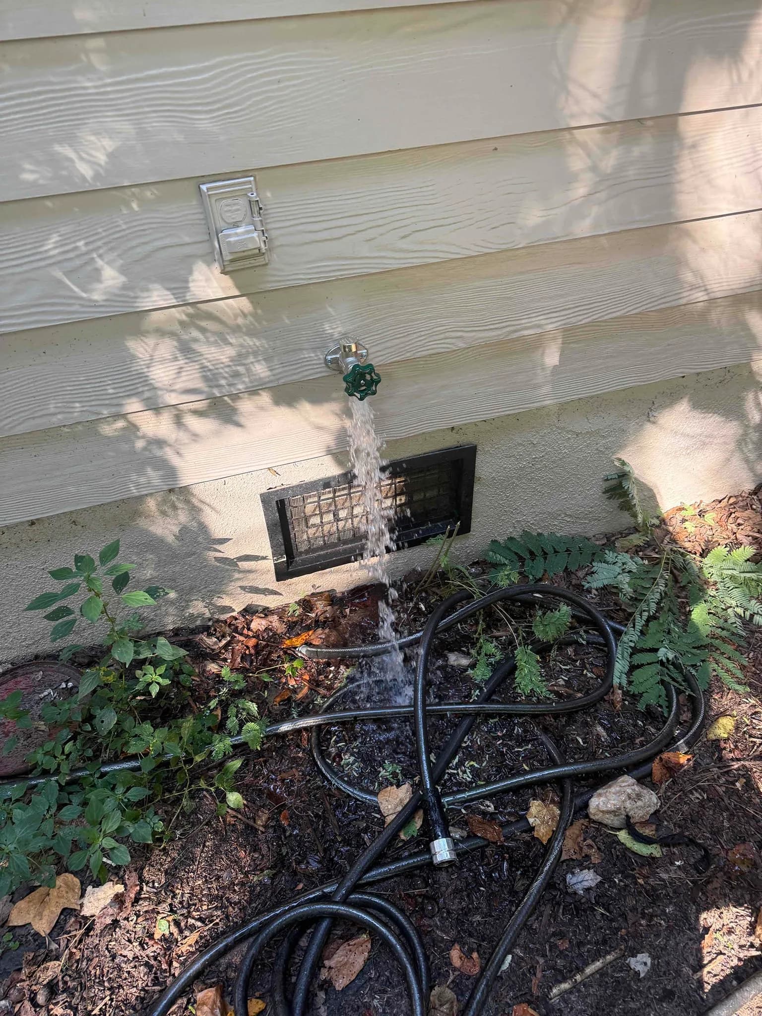Taped-Up Outdoor Faucet Still Leaking in Cary